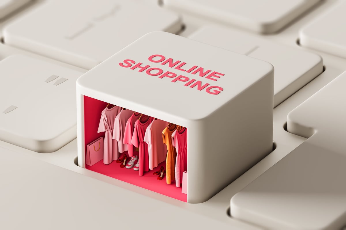 Miniature boutique clothing store displayed inside a keyboard key